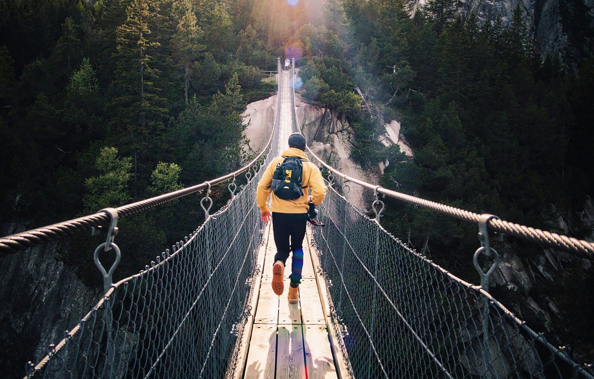 Man on suspension bridge