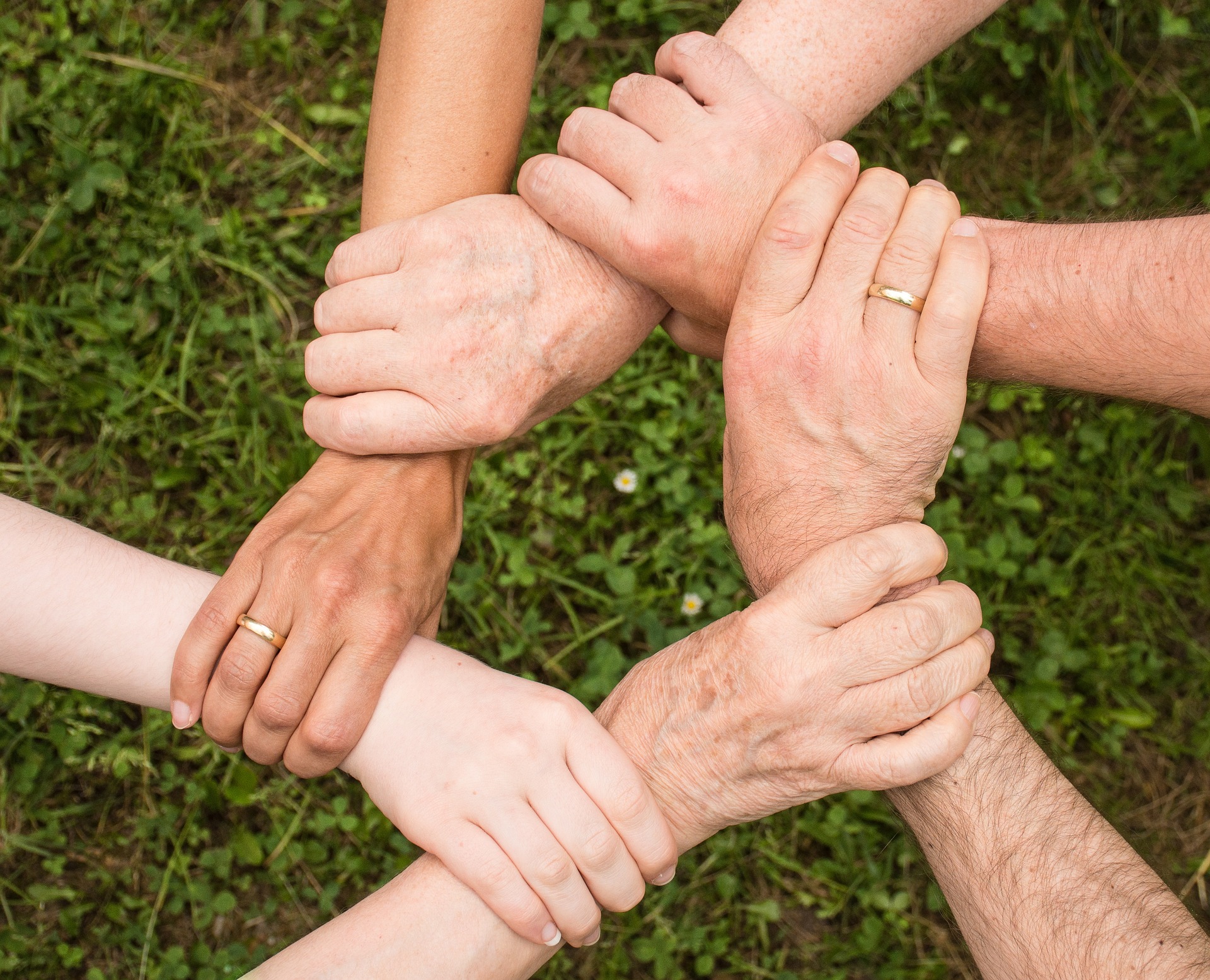 interlocking hands holding wrists